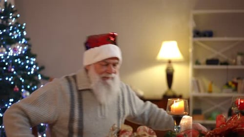 Thoughtful Senior Man at Christmas Table