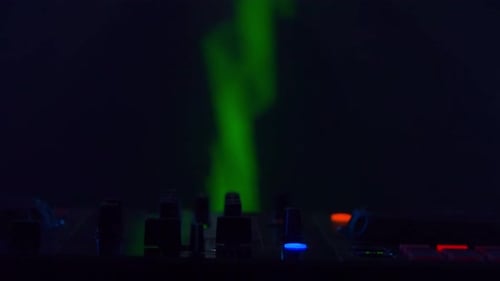 DJ Setup with Vibrant Light Show in Club Atmosphere