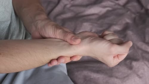 Man Suffering From Hand and Wirst Pain Male Massaging Painful Hand Hurting From Carpal Tunnel