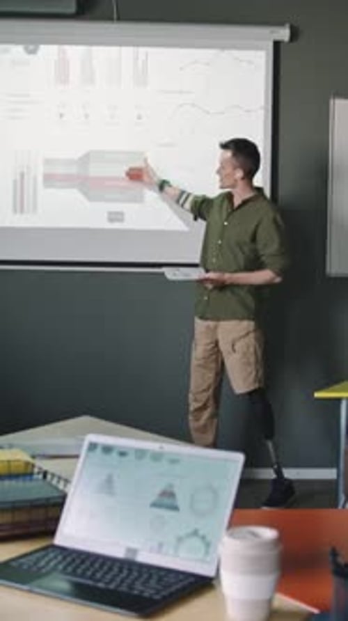 Man Presents Data in Office Setting