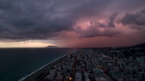 Aerial View of the City Panorama on the Horizon Boundless Sea and Mountains Blue Hour in Awesome