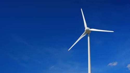 Wind Turbine Spinning Against a Blue Sky
