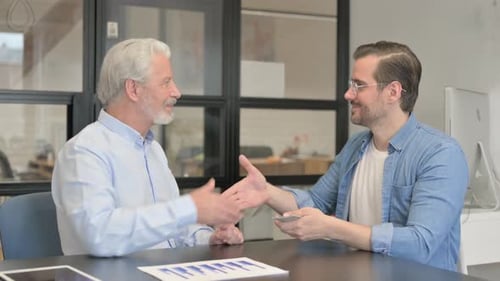 Old Businessman Gives Money and Shakes Hand with Young Man