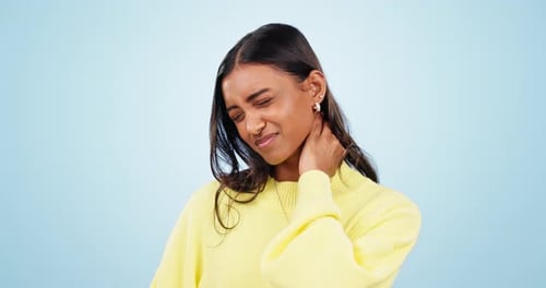 Woman Rubbing Neck in Pain and Discomfort