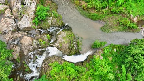 Breathtaking waterfall in lush tropical forest. Aerial beauty.