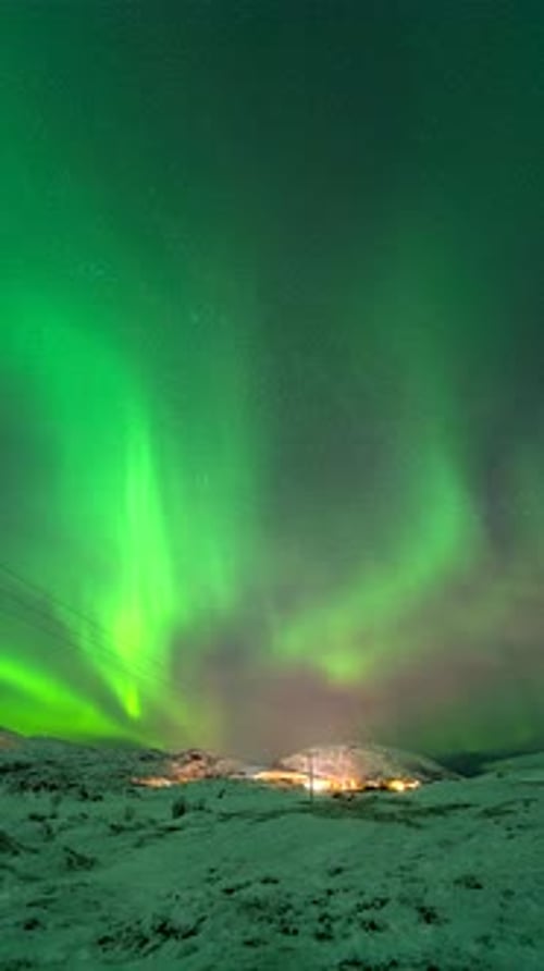 Vertical View Of Dramatic Sky With Aurora Borealis Near Kvaloyvaagen, Norway. Timelapse