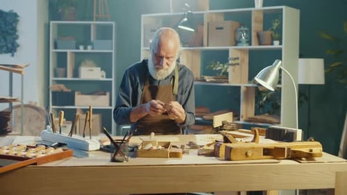 Senior Adult Working on a Wood Carving