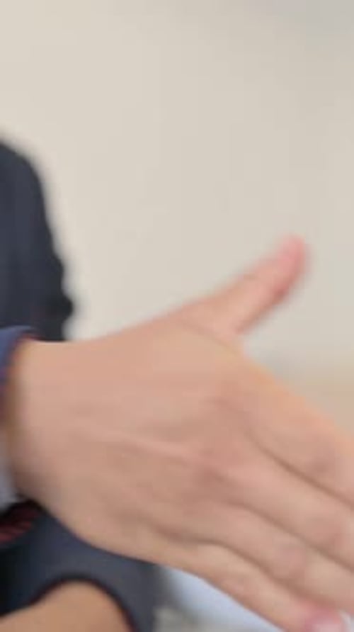 Close up of Hand Shake at Work, vertical video