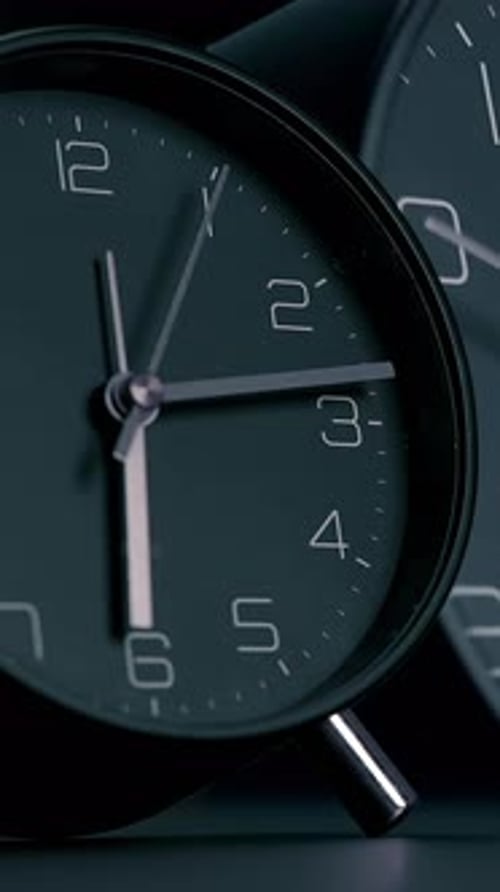 A CloseUp of a Modern Alarm Clock Featuring a Stylish Minimalist Design Aesthetic