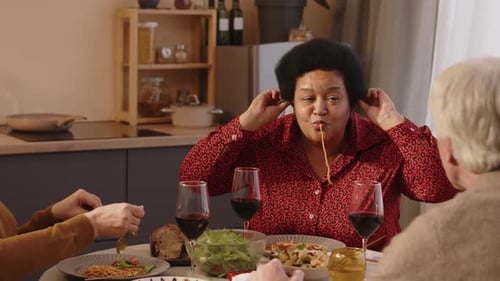 Adults Eating Pasta at Home Together