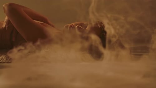 Serene Woman Lying on Fur in Golden Light