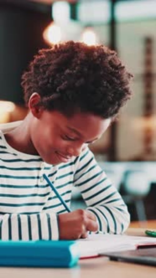Education, laptop and child with homework in house for elearning, studying or development