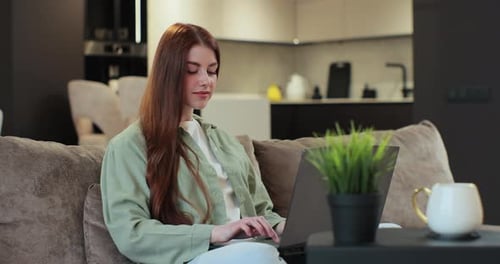 Businesswoman Works From Home Using Computer Young Woman Freelancer Working Remote Typing on Laptop
