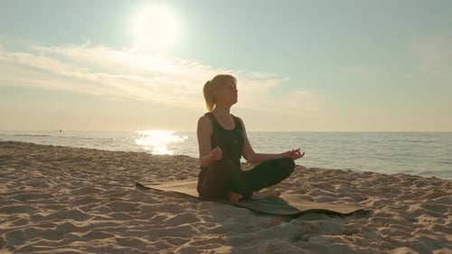 Woman Sitting in Meditation Pose on Sea Beach Lotus Position Medicine Yoga Asana Balance Kundalini