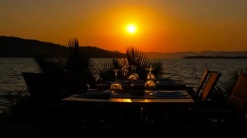 Served Table Silhouette at Sunset By the Sea