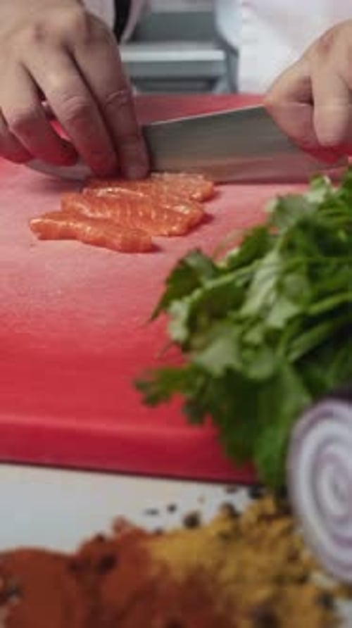 Chef Slices Salmon in Restaurant Kitchen