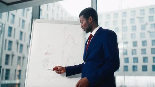 Startup Presentation for Investors Black Man Drawing Sales Diagram in Office Diverse People Working