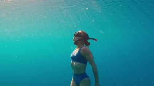 Woman Snorkeling in Turquoise Ocean Waters