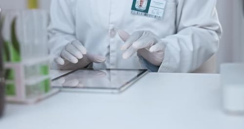 Scientist Using Tablet in Medical Research Lab