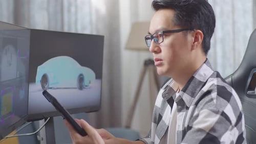 Engineer Works on Car Design in Home Office