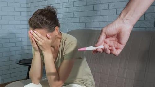 Stressed Husband with Pregnancy Test