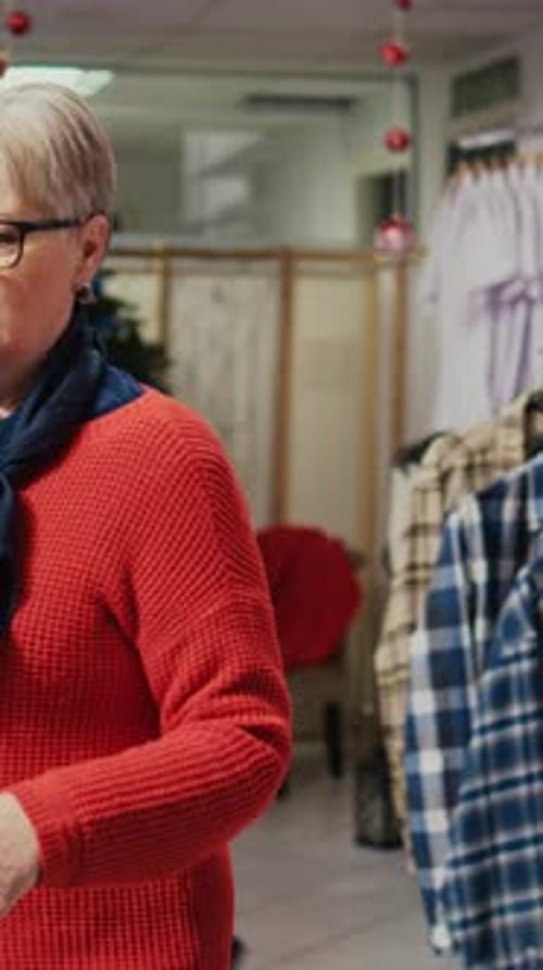 Vertical Video Elderly Client Looking at Shirts