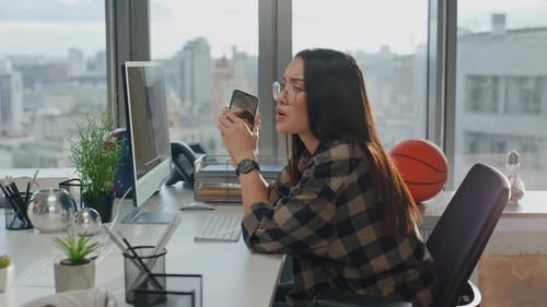 Businesswoman calling partner at windows place focused man texting laptop answering lady at city vi