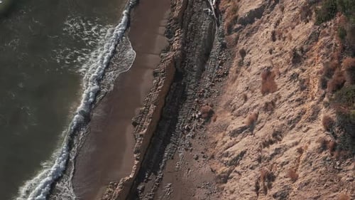 Aerial Top Down Shot of Coast is Rocky on California Coast
