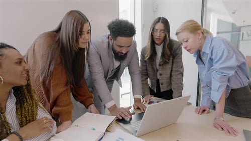 A Diverse Team of Professionals Collaborating Effectively in a Modern Innovative Office Space