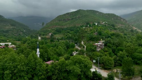 Aerial View Ancient Village Charm Surrounded By Forest Greenery
