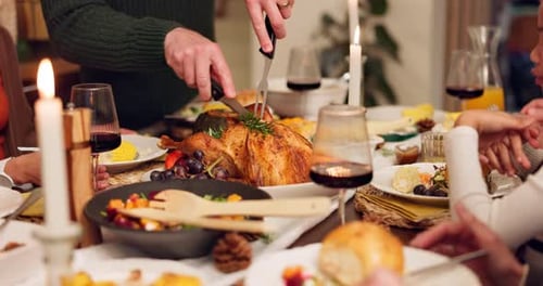 Thanksgiving, hands and cutting turkey for dinner, celebration and reunion