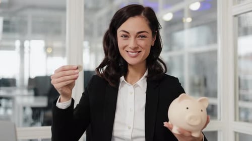 Businesswoman Saves Money Holding Piggy Bank and Coin in Office