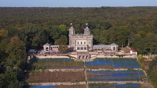 grand majestic castle by tranquil river. Beautiful aerial top view flight panorama overview drone
4k