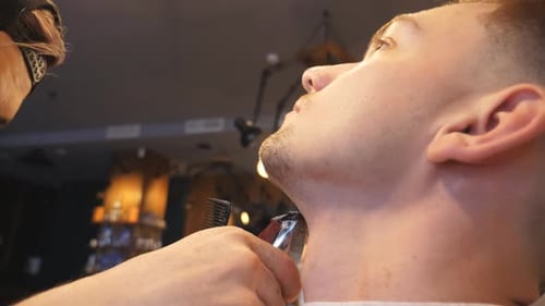 Man Gets Beard Trim at the Barber Shop