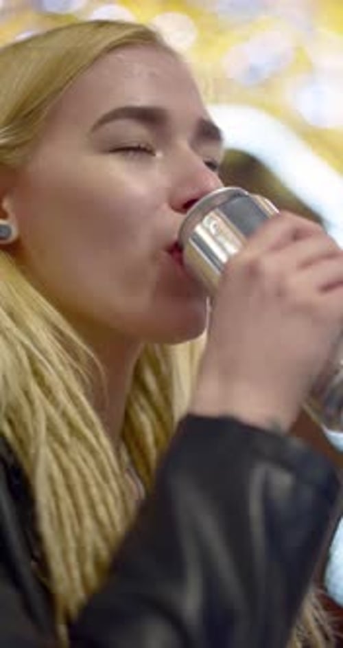 Teenage Girl Drinking Energy Drink From Can