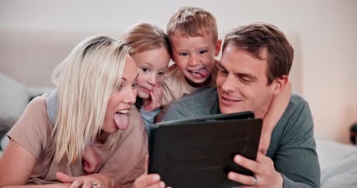 Happy Family Uses Tablet Device at Home