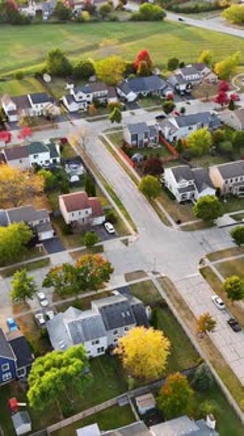 Aerial View of Suburban Neighborhood in Fall Vibrant Aerial View of a Suburban Neighborhood with