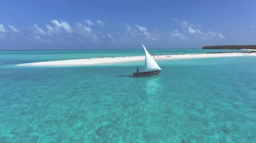 Aerial view of boat sailing on turquoise water, Maldives.