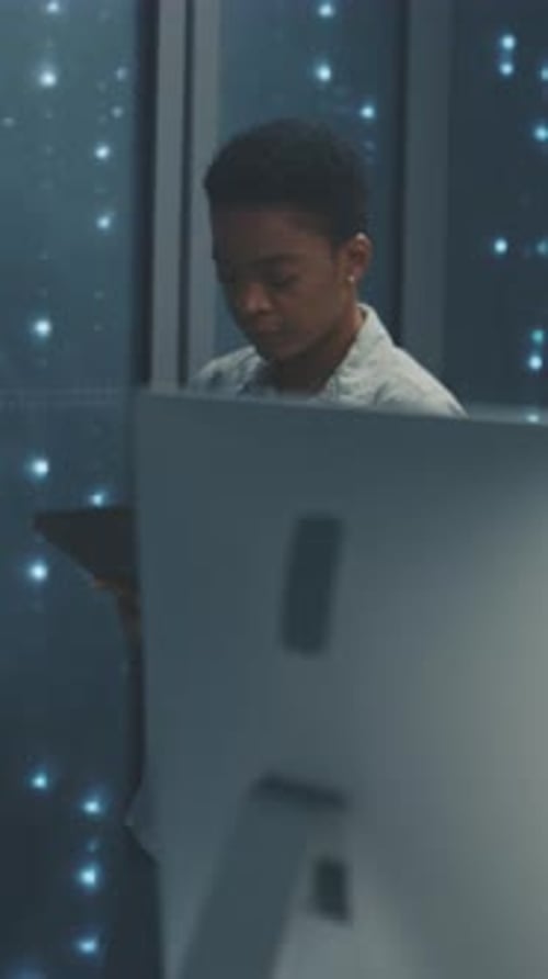 Woman Uses Tablet in Data Center Server Room