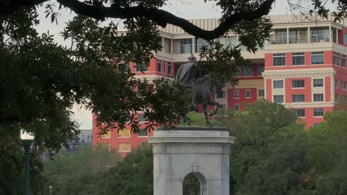 Reveal of Sam Houston Statue behind trees in Houston, TX