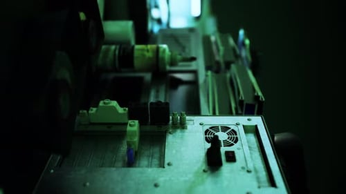 Close-up of Electronic Hardware in Dark Server Room