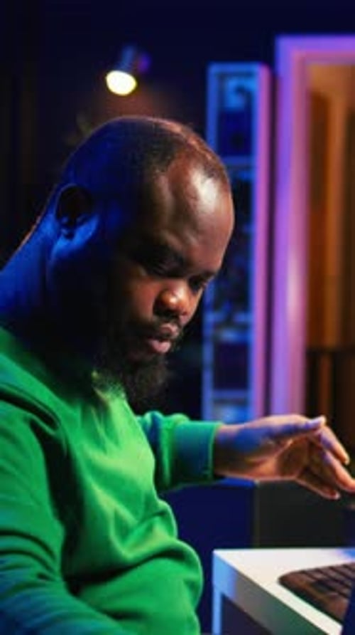 Vertical Video Producer Composing New Music on Acoustic Instrument in Home Studio