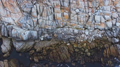 Aerial View of the Pacific Ocean Waves Hitting the Cliff Rocks