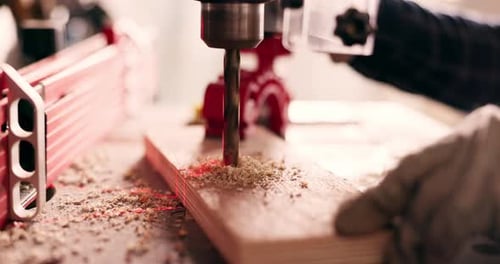 Wood, closeup and drill with person in workshop for furniture, manufacturing and renovation
