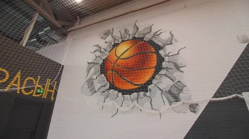 3d Image of Ball Breaking Wall in Light Basketball Gym