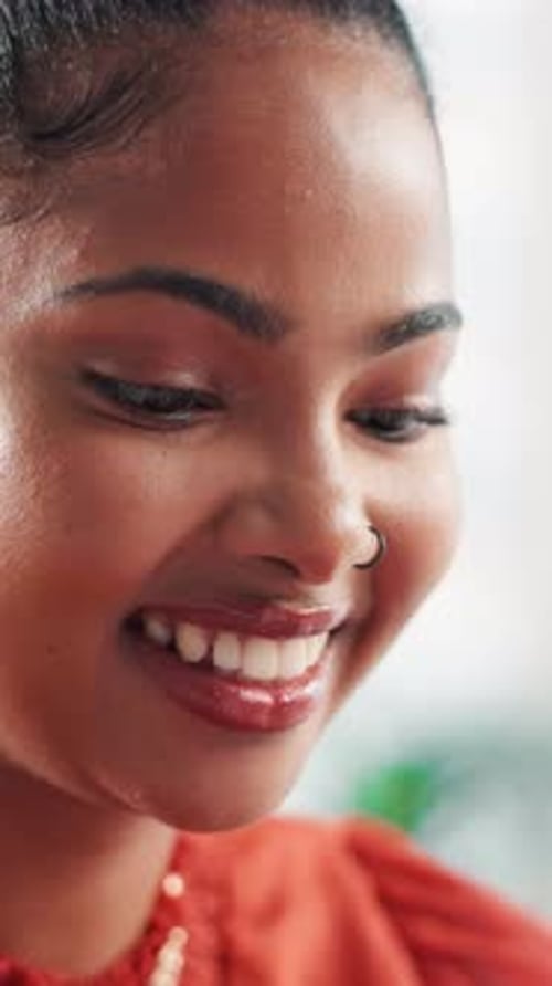 Smile, African woman and reading in office for research, proofreading and draft update