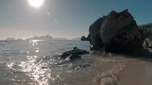 Seascape Ocean and Beautiful Beach Rocks on Sandy Beach with Blue Sea Waves on Sunny Day Palawan