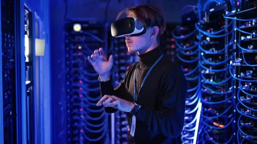 Man using Virtual Reality headset in a server room