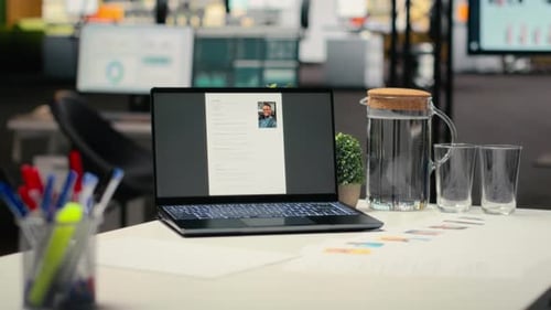 Empty Company Space with a Laptop Showing CV Applicant Before Job Interview