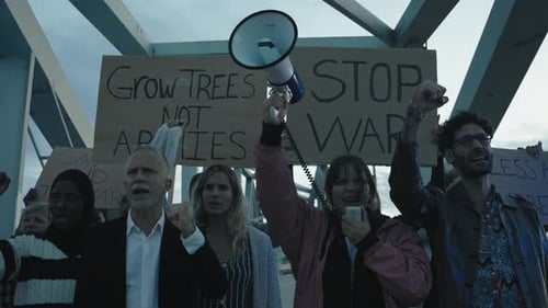 Group Protests Against War with Megaphone and Signs